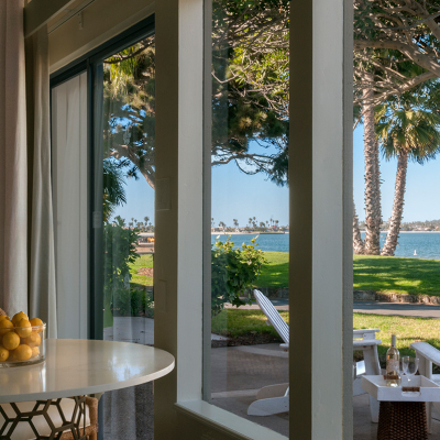 Room view out of window to patio and waterfront