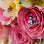 Crown Ring with a 15, nestled in a pink rose for a Quinceanera
