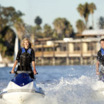 Couple on Waverunner Jet Skis - Action Sports Rentals at Paradise Point Marina