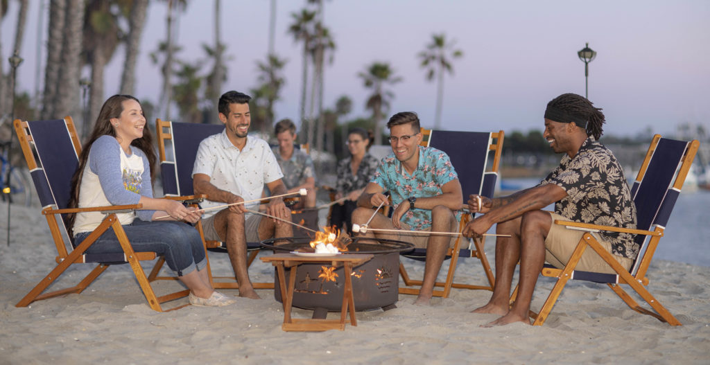 People making smores on the beach