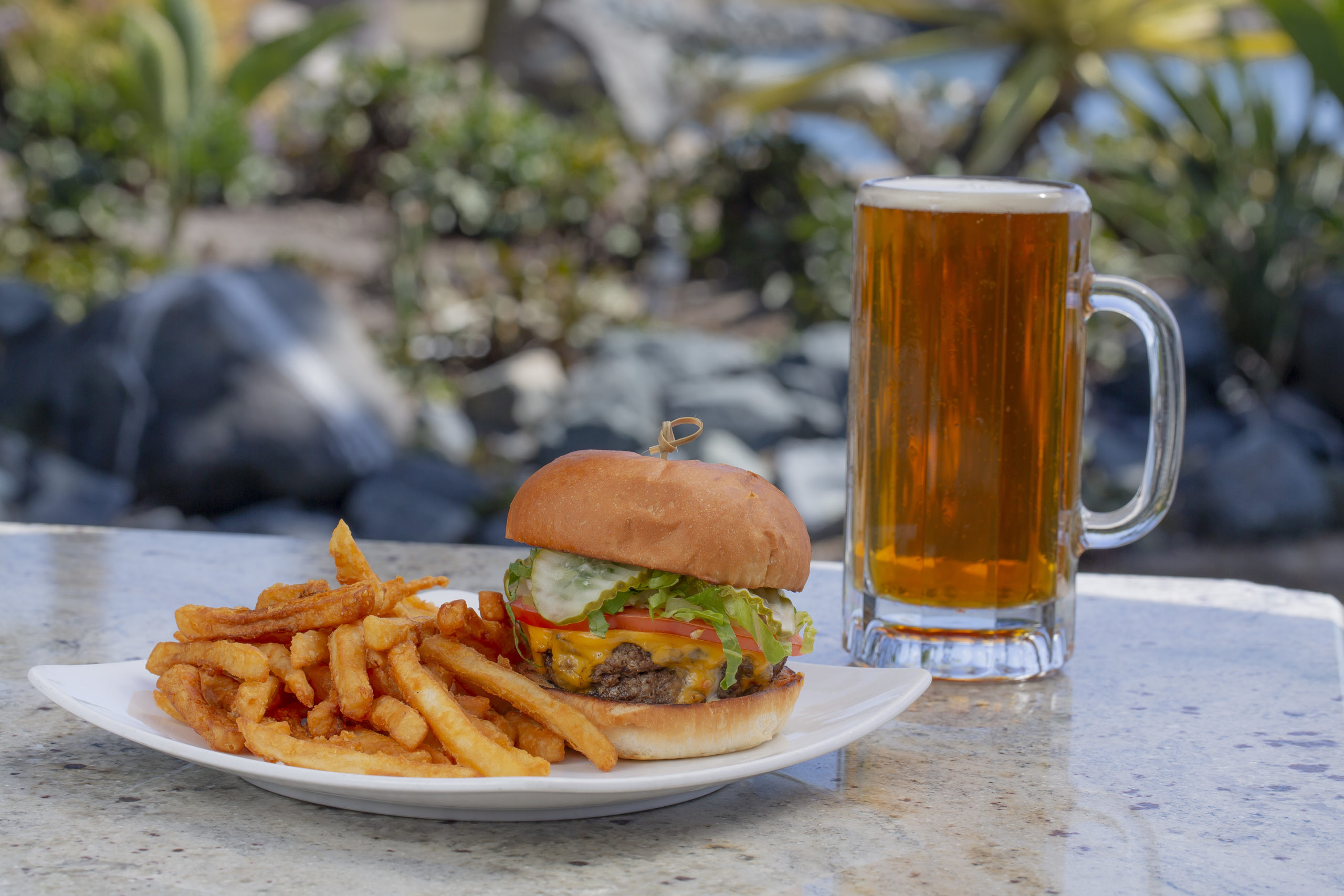 Burger and fries with tall beer