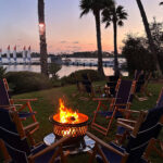waterfront bonfire with sunset