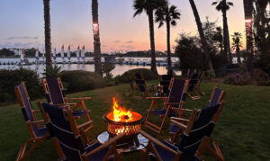 waterfront bonfire with sunset