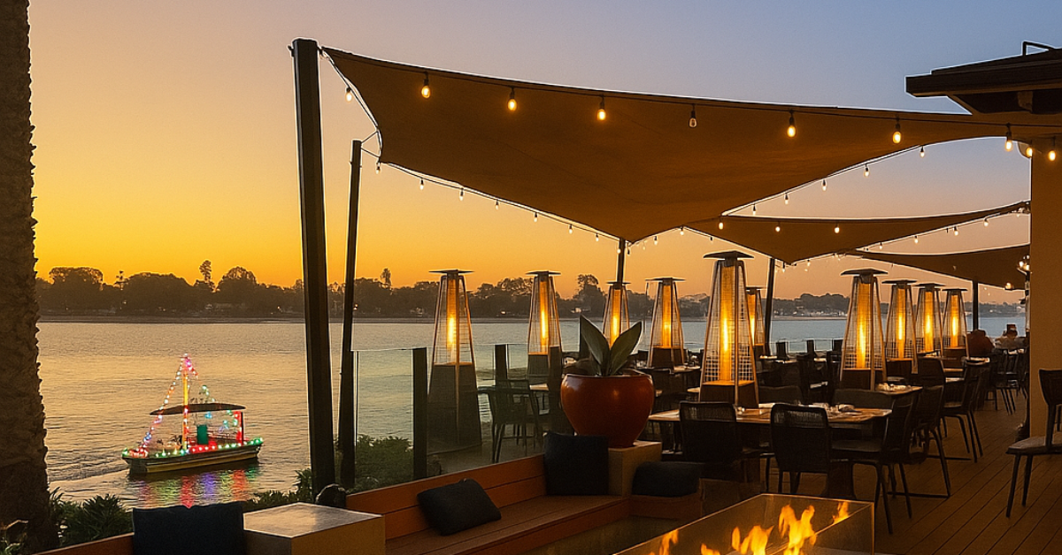 sunset dining with decorated boat on the bay