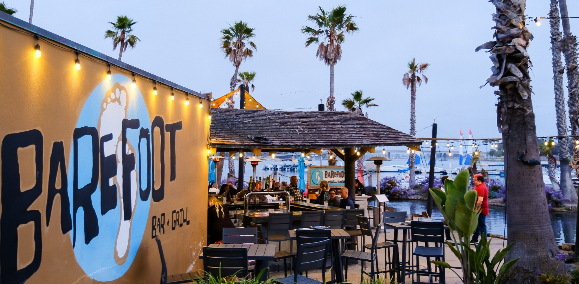 tropical dining setting with market lights